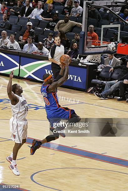 Larry Hughes of the New York Knicks puts up a shot against Raymond Felton of the Charlotte Bobcats during the game on December 15, 2009 at Time...