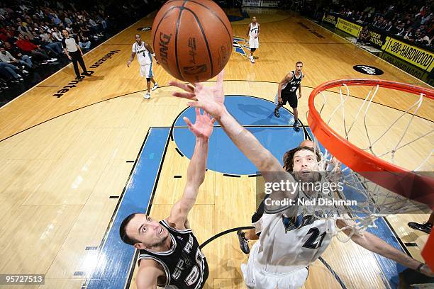 Manu Ginobili of the San Antonio Spurs and Fabricio Oberto of the Washington Wizards go for the rebound during the game on January 2, 2010 at the...