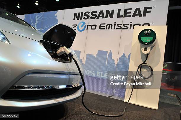 The Nissan Leaf prototype electric car on display during the press preview for the world automotive media North American International Auto Show at...