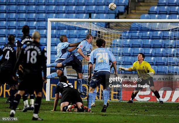 Stephen Wright of Coventry heads an own goal past teammate Keiren Westwood in the final minutes to level the scores at 1-1 during the FA Cup...