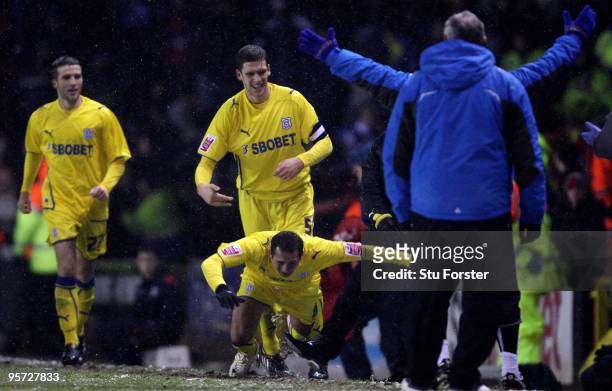Cardiff goalscorer Michael Chopra is tripped up after scoring by Bristol City manager Gary Johnson during the FA Cup sponsored by E.ON 3rd Round...