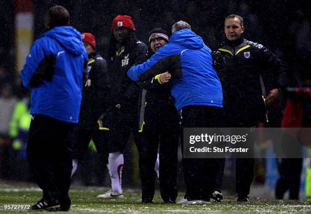 Bristol City manager Gary Johnson and Cardiff manager Dave Jones embrace at the final whistle during the FA Cup sponsored by E.ON 3rd Round match...