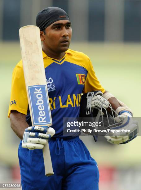 Sri Lanka's Mahela Jayawardene leaves the field after being dismissed for 100 runs during the ICC World Twenty20 group match between Sri Lanka and...