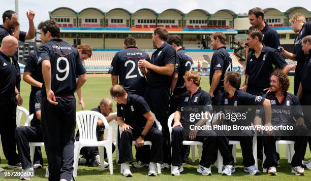 England's James Tredwell falls off a chair as the England team get ready for a team photograph before the ICC World Twenty20 Semi Final against Sri...