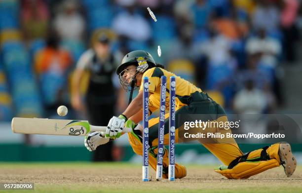 Lisa Sthalekar of Australia is bowled for 18 runs by Sophie Devine of New Zealand during the ICC Women's World Twenty20 Final between Australia Women...