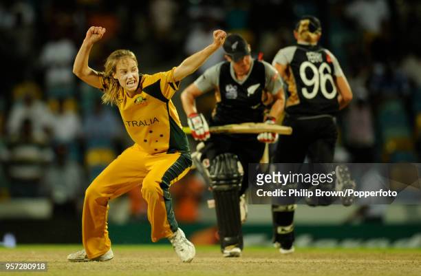 Ellyse Perry of Australia celebrates as Sophie Devine and Liz Perry of New Zealand can only manage a single from the final ball and Australia win the...