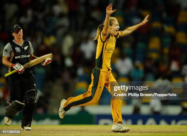 Ellyse Perry of Australia celebrates as Sophie Devine of New Zealand and batting partner Liz Perry can only manage a single from the final ball and...