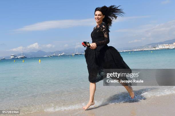 Catrinel Marlon is seen wearing dress Ermanno Scervino, bag and shoes Christian Louboutin during the 71st annual Cannes Film Festival at on May 11,...