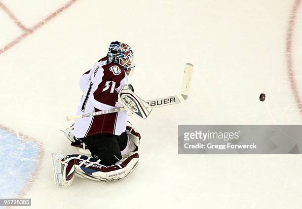 Peter Budaj of the Colorado Avalanche deflects a shot on goal during a NHL game against the Carolina Hurricanes on January 8, 2010 at RBC Center in...