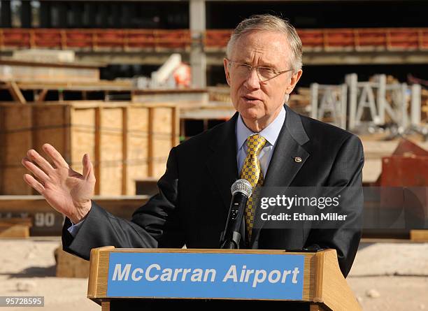 Senate Majority Leader Sen. Harry Reid speaks during a news conference after touring a new terminal under construction at McCarran International...