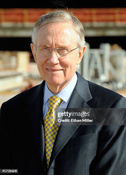 Senate Majority Leader Sen. Harry Reid waits to speak during a news conference after touring a new terminal under construction at McCarran...