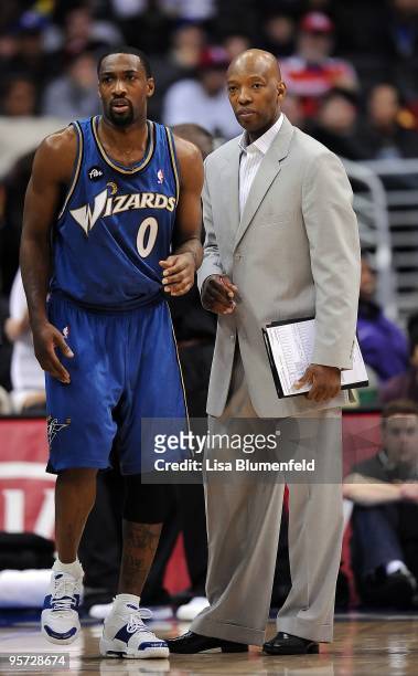 Gilbert Arenas and coah Sam Cassell of the Washington Wizards look on during the game against the Los Angeles Clippers at Staples Center on December...