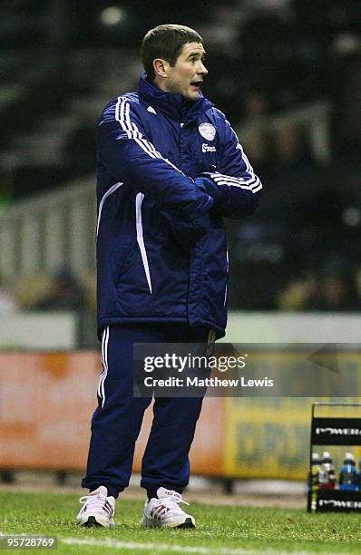 Nigel Clough, manager of Derby County looks at his watch during the FA Cup 3rd Round Replay match between Derby County and Millwall at Pride Park on...