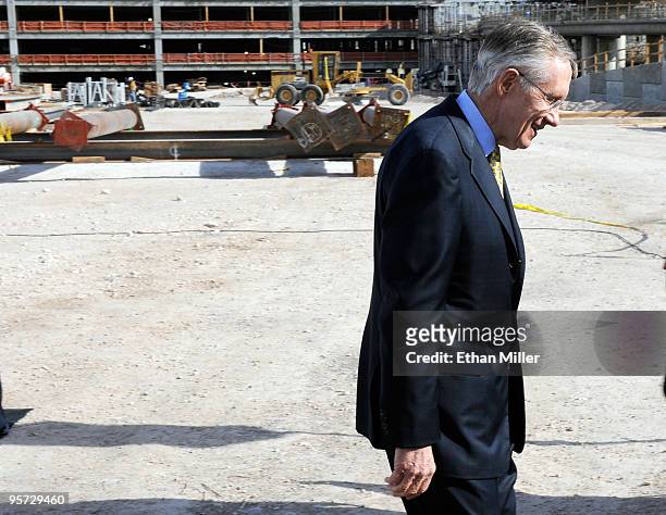 Senate Majority Leader Sen. Harry Reid leaves a news conference held after he toured a new terminal under construction at McCarran International...