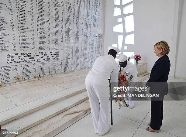 Secretary of State Hillary Clinton lays a wreath during a visit to the USS Arizona Memorial at Pearl Harbor in Honolulu January 12, 2010. The...