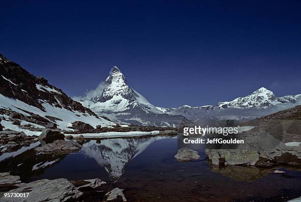 the matterhorn reflected in riffelsee - jeff goulden stock pictures, royalty-free photos & images