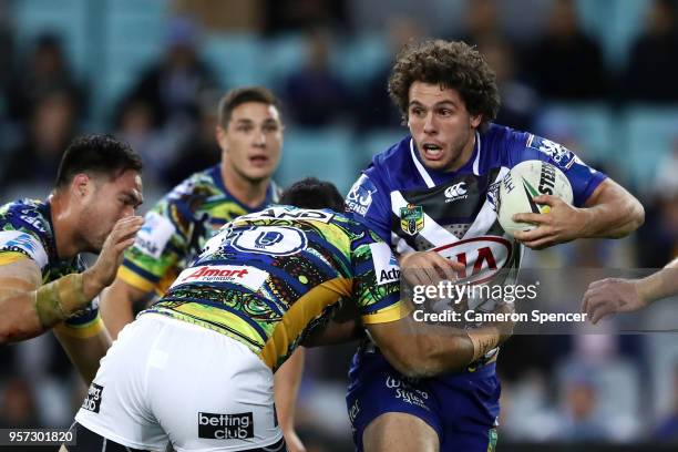 Adam Elliot of the Bulldogs is tackled during the round 10 NRL match between the Canterbury Bulldogs and the Parramatta Eels at ANZ Stadium on May...
