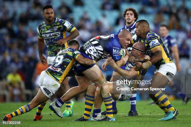 David Klemmer of the Bulldogs is tackled during the round 10 NRL match between the Canterbury Bulldogs and the Parramatta Eels at ANZ Stadium on May...
