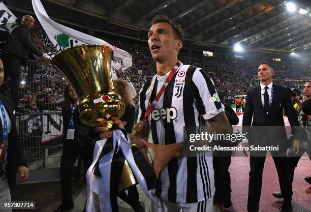 Mario Mandzukic of Juventus celebrates the victory after the TIM Cup Final between Juventus and AC Milan at Stadio Olimpico on May 9, 2018 in Rome,...