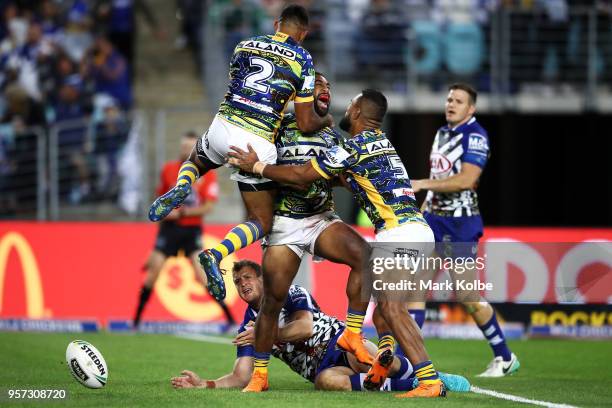 Michael Jennings of the Eels celebrates with his team mates after scoring a try only to have the try disallowed during the round 10 NRL match between...