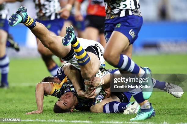 Mitchell Moses of the Eels is tackled during the round 10 NRL match between the Canterbury Bulldogs and the Parramatta Eels at ANZ Stadium on May 11,...