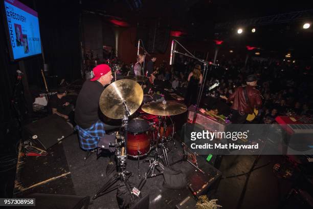 Drummer Chad Smith of the Red Hot Chili Peppers and Guitarist Mike McCready of Pearl Jam perform on stage during the MusiCares Concert For Recovery...