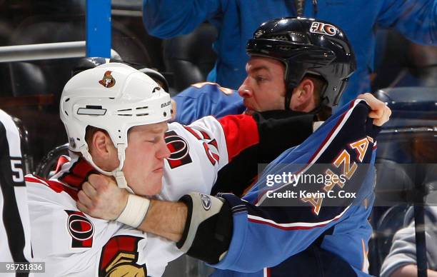 Chris Neil of the Ottawa Senators fights with Eric Boulton of the Atlanta Thrashers at Philips Arena on January 12, 2010 in Atlanta, Georgia.