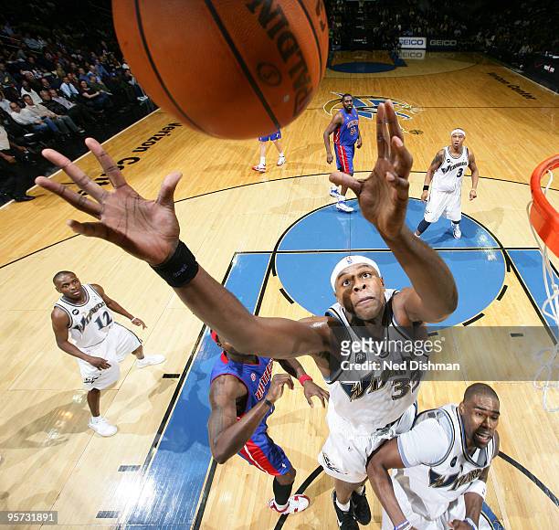 Brendan Haywood of the Washington Wizards rebounds against Ben Wallace of the Detroit Pistons at the Verizon Center on January 12, 2010 in...