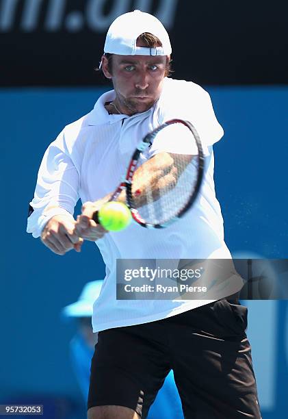 Benjamin Becker of Germany plays a backhand in his second round match against Richard Gasquet of France during day four of the 2010 Medibank...