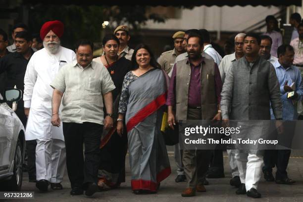 Leaders Mukhtar Abbas Naqvi, Dharmendra Pradhan, JP Nadda, SS Ahluwalia, Meenakshi Lekhi and Smriti Irani leave after a meeting with Election...