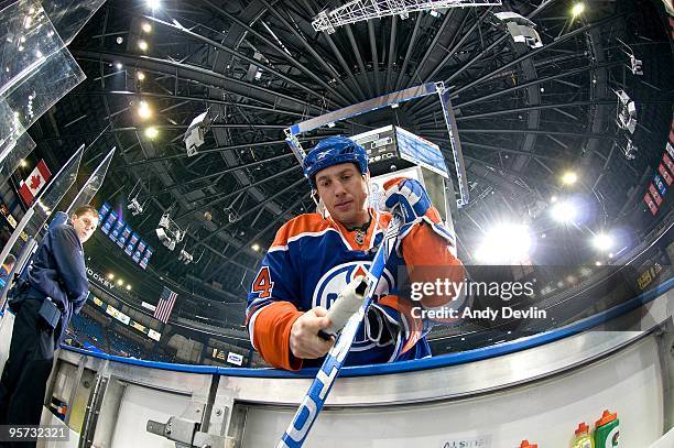 Fernando Pisani of the Edmonton Oilers makes an adjustment to his stick during warm-up before a game against the Nashville Predators at Rexall Place...