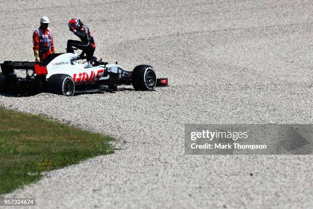 Romain Grosjean of France and Haas F1 climbs out of his car after spinning during practice for the Spanish Formula One Grand Prix at Circuit de...