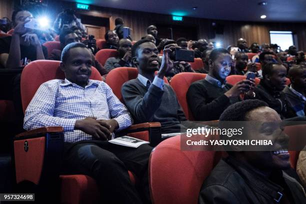 Students react during the public viewing of the deployment of Kenya's first nano satellite from the International Space Station at the University of...