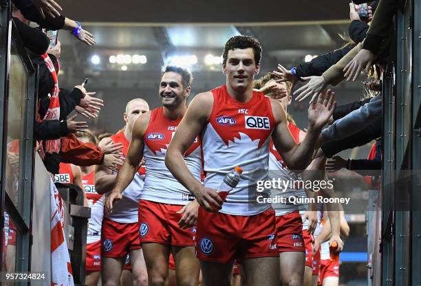 Tom McCartin of the Swans high fives fans after winning the round eight AFL match between the Hawthorn Hawks and the Sydney Swans at Melbourne...