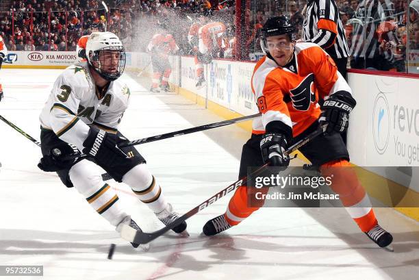 Daniel Briere of the Philadelphia Flyers plays the puck past Stephane Robidas of the Dallas Stars on January 12, 2010 at Wachovia Center in...