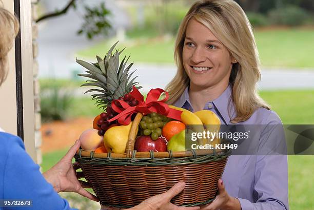 fruit basket delivery - fruitschaal stockfoto's en -beelden