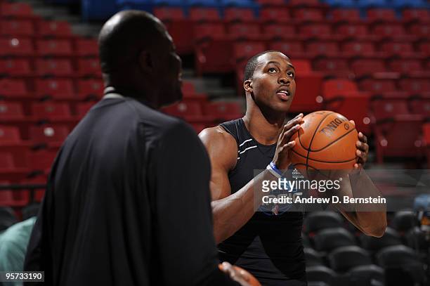 Dwight Howard of the Orlando Magic warms up with coach Patrick Ewing prior to the game against the Sacramento Kings on January 12, 2010 at Arco Arena...