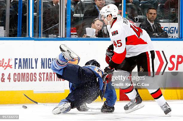 Eric Boulton of the Atlanta Thrashers falls down in front of Alexandre Picard of the Ottawa Senators at Philips Arena on January 12, 2010 in Atlanta,...