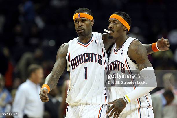 Teammates Stephen Jackson and Gerald Wallace of the Charlotte Bobcats celebrate after a 102-94 victory over the Houston Rockets at Time Warner Cable...