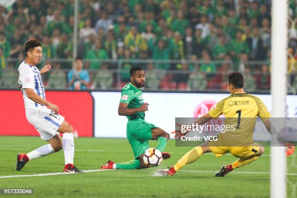 Cedric Bakambu of Beijing Guoan shoots the ball during 2018 China Super League match between Beijing Guoan and Guangzhou R&F at Beijing Workers...