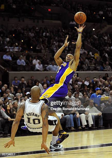 Guard Derek Fisher of the Los Angeles Lakers is called for a foul against Keith Bogans of the San Antonio Spurs on January 12, 2010 at AT&T Center in...