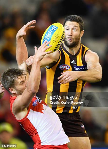 Kieren Jack of the Swans and James Frawley of the Hawks compete for a mark during the round eight AFL match between the Hawthorn Hawks and the Sydney...