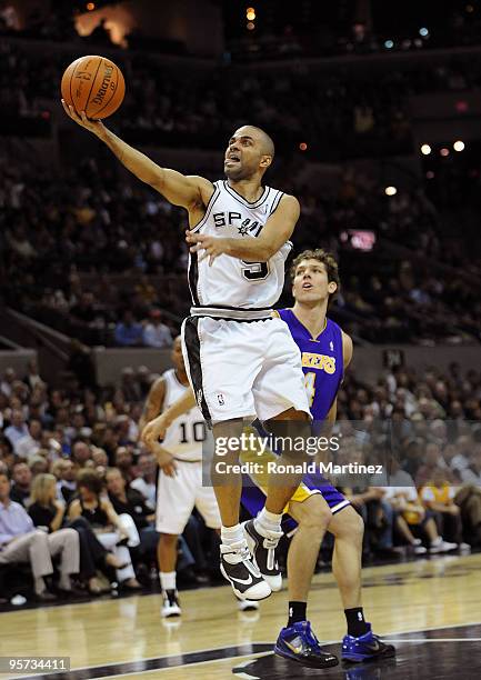 Guard Tony Parker of the San Antonio Spurs takes a shot against Luke Walton of the Los Angeles Lakers on January 12, 2010 at AT&T Center in San...