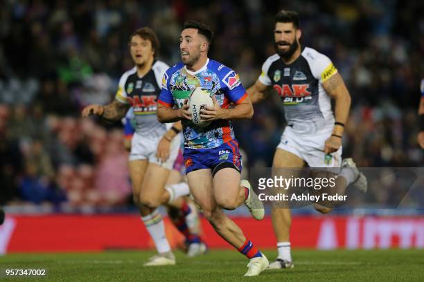 Brock Lamb of the Knights runs the ball during the round 10 NRL match between the Newcastle Knights and the Penrith Panthers at McDonald Jones...