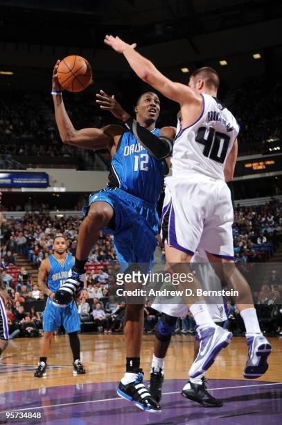 Dwight Howard of the Orlando Magic goes up for the shot against Jon Brockman of the Sacramento Kings on January 12, 2010 at Arco Arena in Sacramento,...