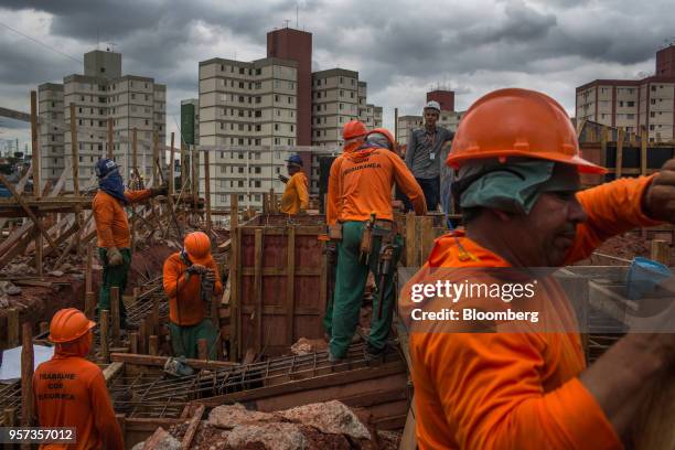 Contractors work during construction of the Reserva Paulista residential complex in Sao Paulo, Brazil, on Wednesday, March 21, 2018. The world's...