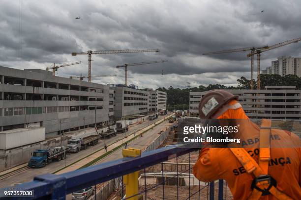 Cranes stand at the construction site of the Reserva Paulista residential complex in Sao Paulo, Brazil, on Wednesday, March 21, 2018. The world's...