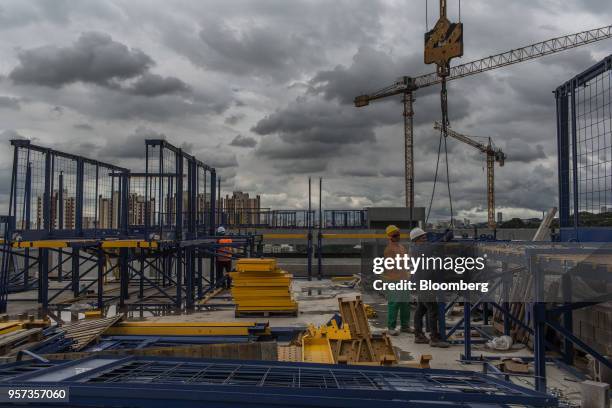 Contractors work during construction at the Reserva Paulista residential complex in Sao Paulo, Brazil, on Wednesday, March 21, 2018. The world's...