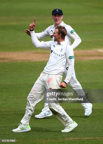 Joe Root of Yorkshire celebrates dismissing Dean Elgar of Surrey during day one of the Specsavers County Championship Division One match between...