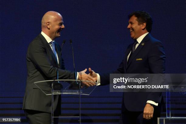 President Gianni Infantino , shakes hands with the president of the South American Football Confederation Alejandro Dominguez, during the 69th...